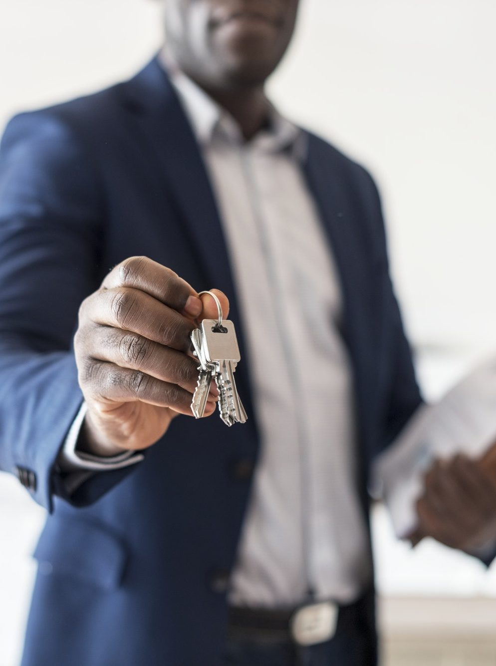 Real estate agent handing the house key